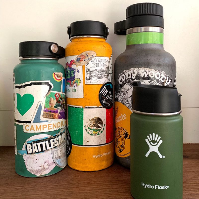 a collection of well loved hydroflasks