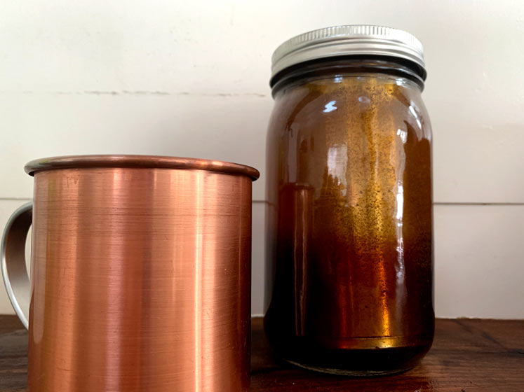 a copper cup and a rumble jar cold brew maker