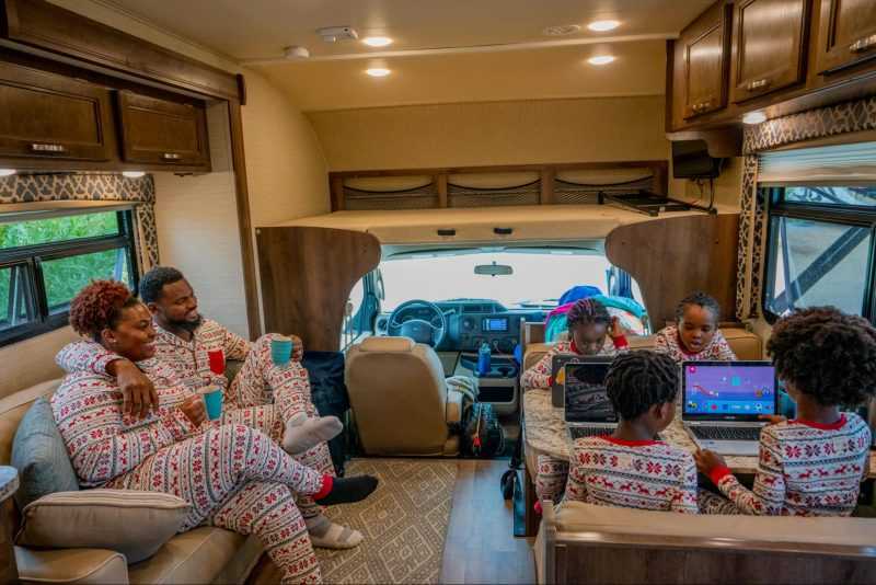 family in matching pajamas in RV