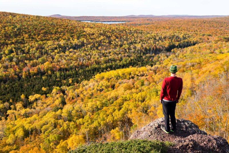 Man looking at fall foliage in Copper Harbor, Michigan