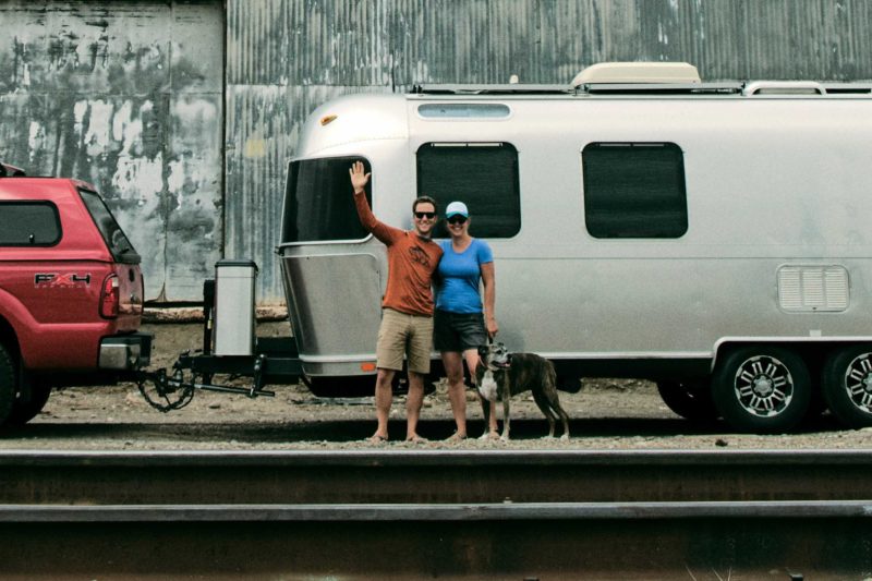 Seth and Drea in front of their Airstream