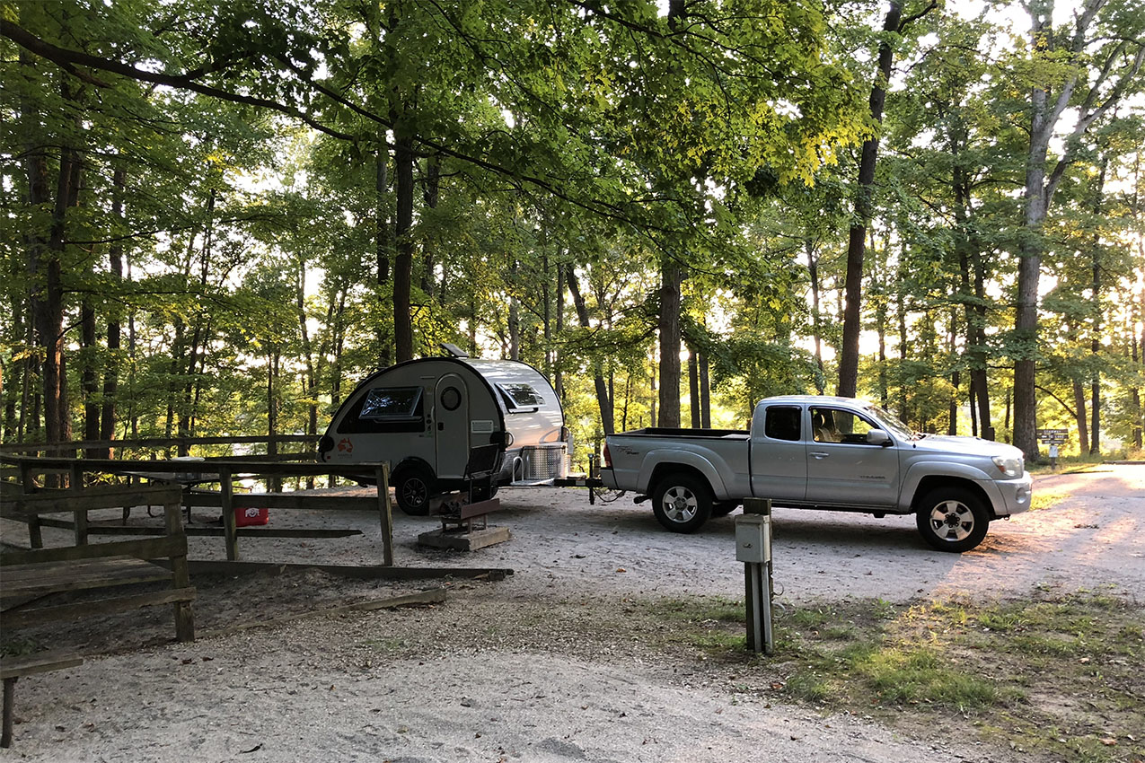 A teardrop trailer camping in an Illinois State Park