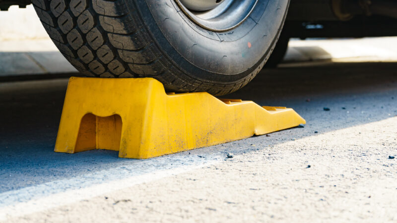 Yellow chock under an RV tire