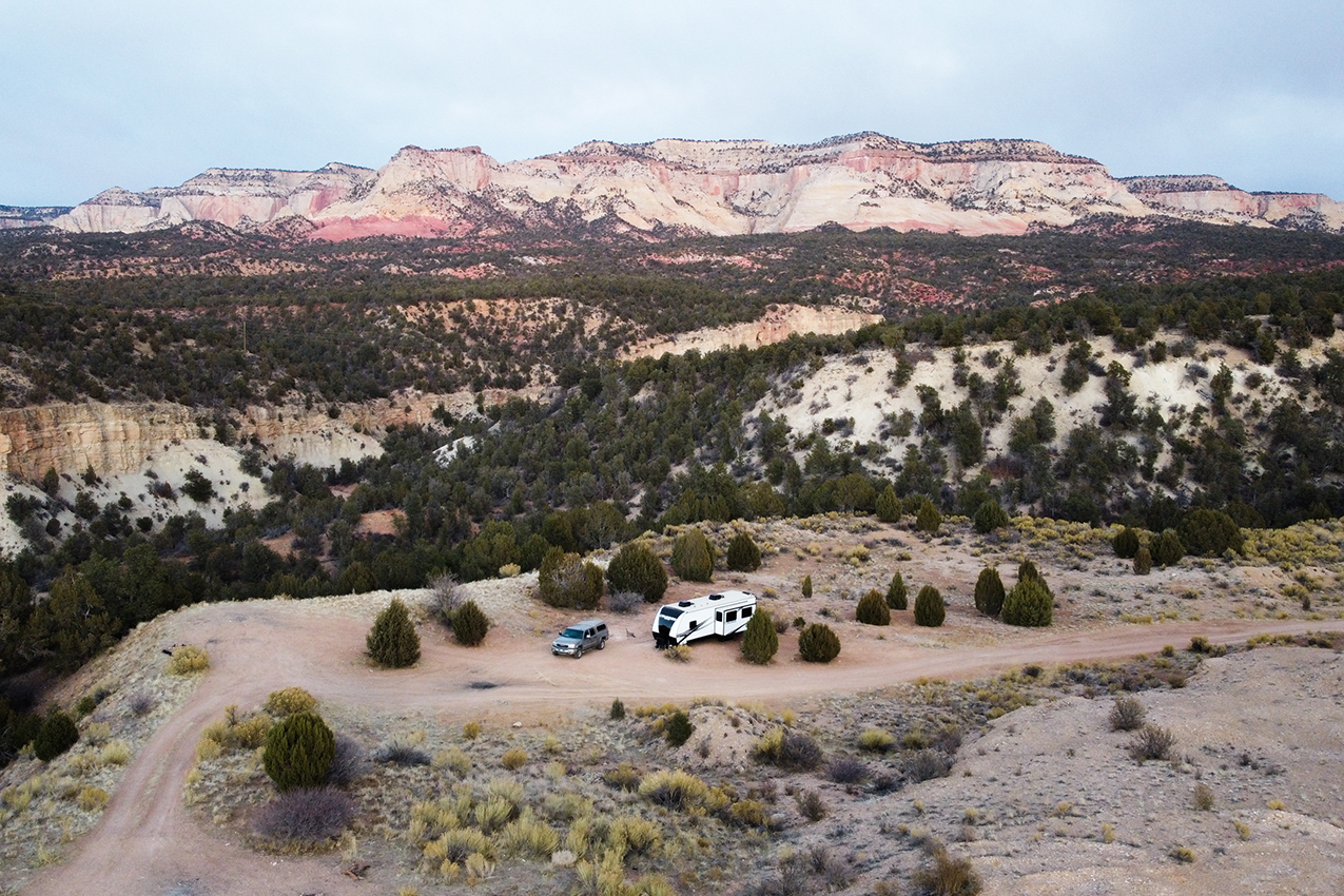 RV surrounded by red rocks.