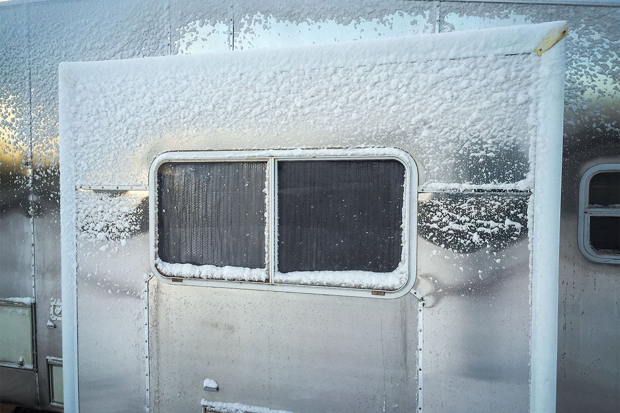 Snowy RV window with Reflectix on the inside.