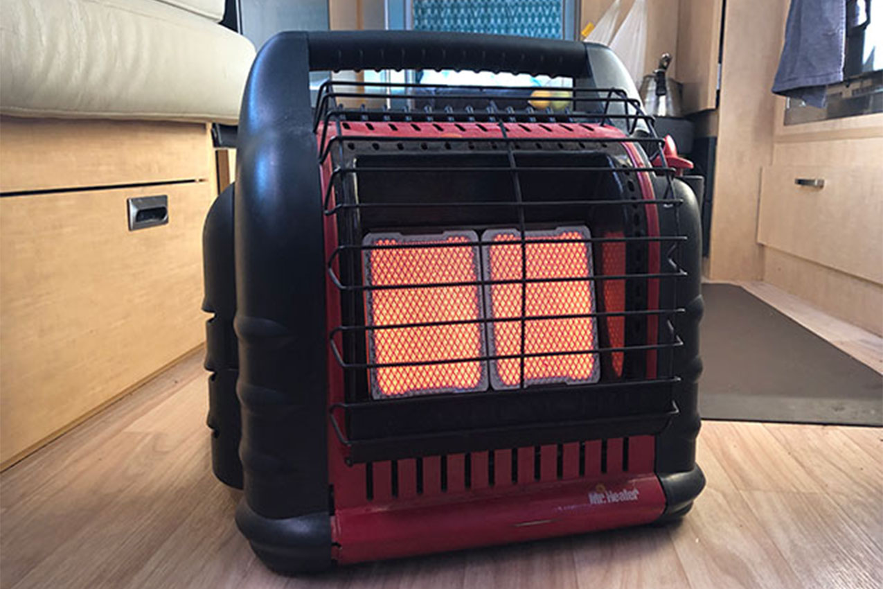 Propane heater on the floor inside an RV.