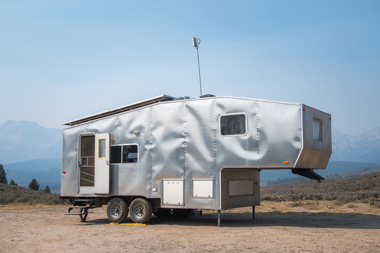 Silver RV with a Proxicast antenna set up.