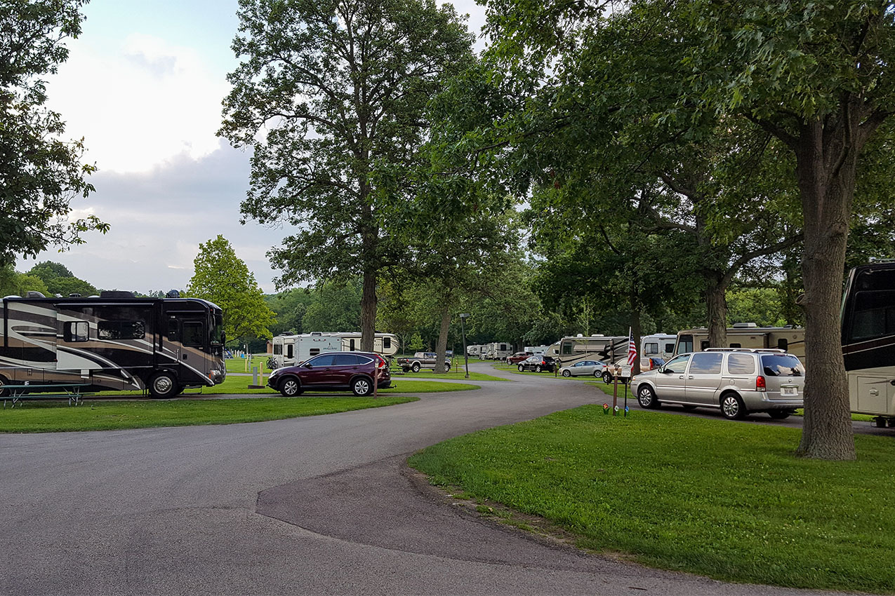 Several RVs parked at a county park.