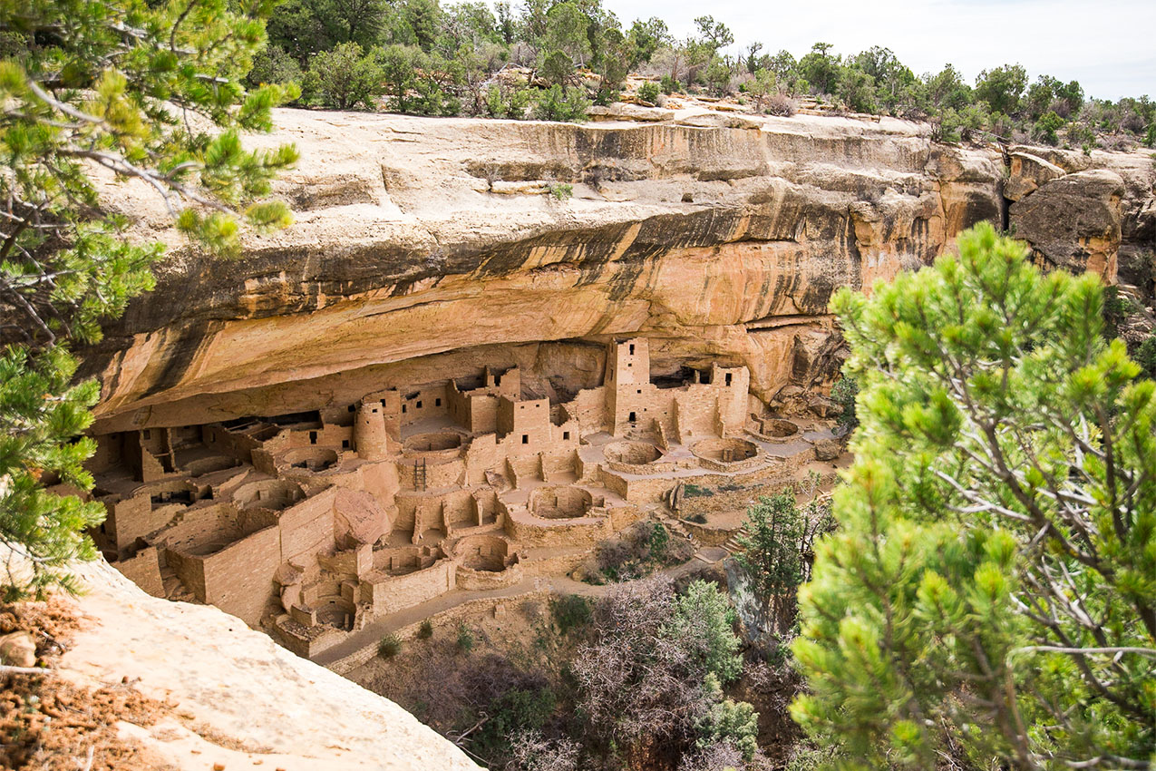 View of ancient cliff dwellings from above.