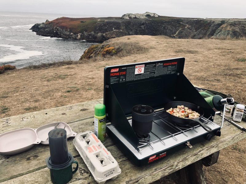 Cooking at a picnic table at Bodega Bay off of Highway 1 in Big Sur, California