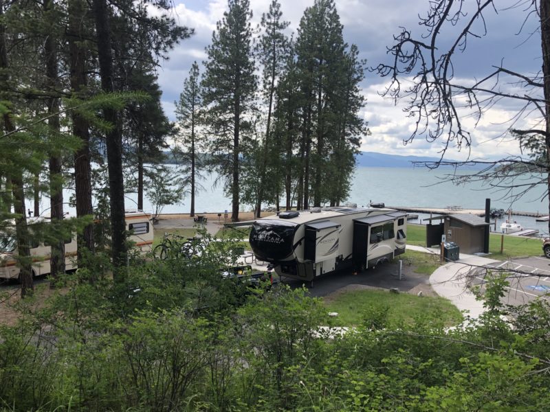 Fifth wheel parked at a lakeside campground