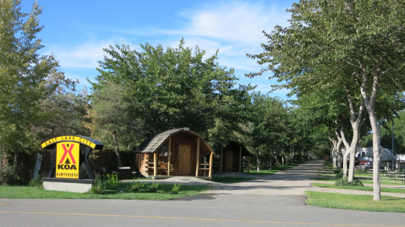 Entrance into KOA campground with wood cabins