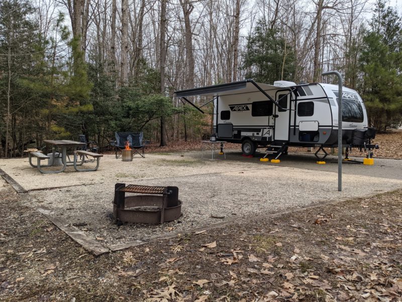 RV parked on stabilizer blocks at a state park campground
