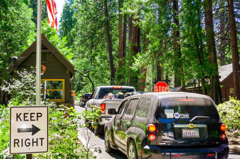 Line of cars at Yosemite National park entrance on a sunny day