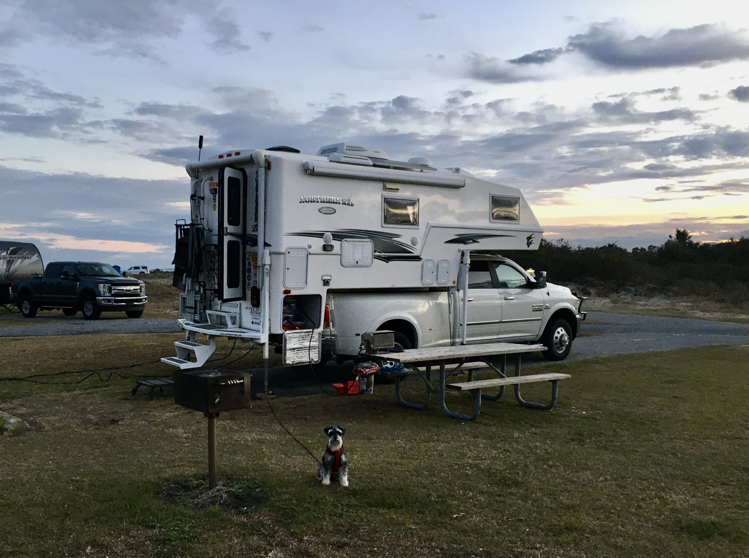 Truck camper parked at a campsite at Oregon Inlet