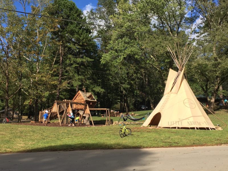 Teepee and playground equipment at an RV campground