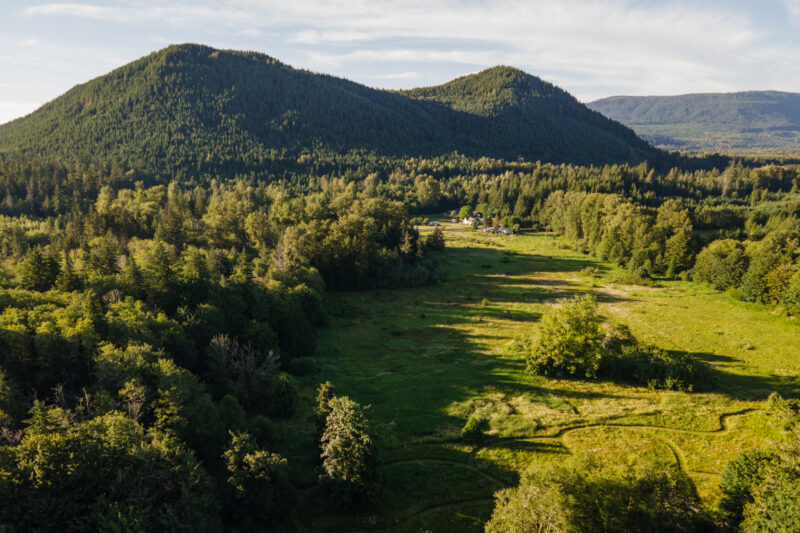 An aerial view of Elkamp’s meadow that has walking paths, relaxation spots, and looks out to the surrounding mountains.