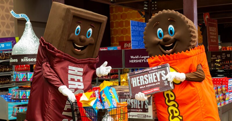 Human-sized candy bars show off a variety of chocolate and candy products.