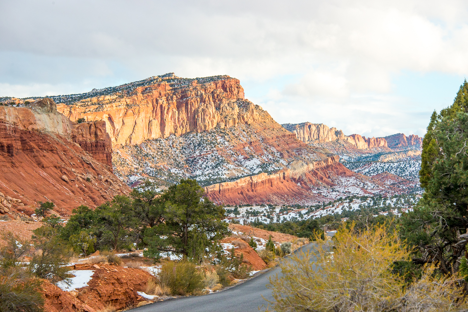 Large rock formations soar into the air, filling the skyline at Utah's Capitol Reef National Park