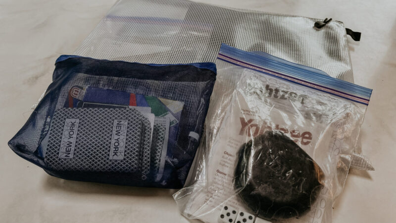 Card and dice games in plastic zip-top storage bags