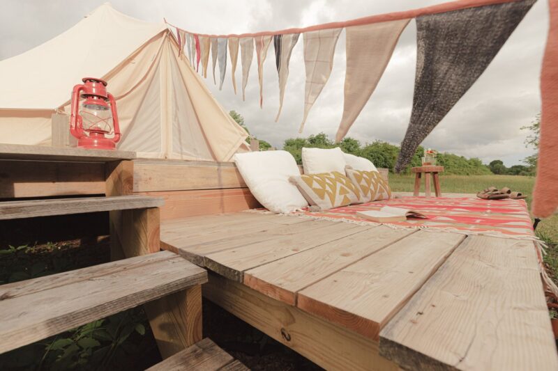 Canvas glamping tent with a platform deck outside