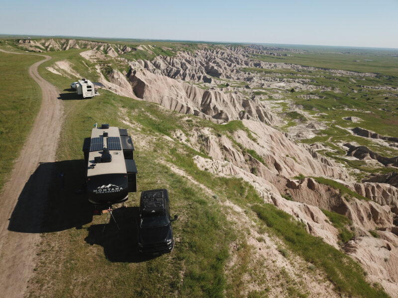 An RV sits on the edge of Badlands National Park