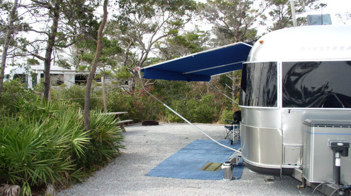 Airstream trailer set up camp on gravel pad