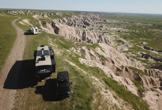 Two RVs parked on a bluff at Nomad View Dispersed Camping in Buffalo Gap Grasslands.
