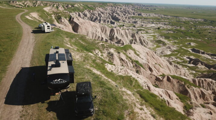 Two RVs parked on a bluff at Nomad View Dispersed Camping in Buffalo Gap Grasslands.