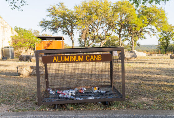 Aluminum can recycling bin outside at a park
