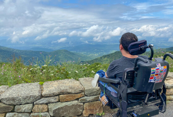 a wheelchair user is parked at a scenic overlook